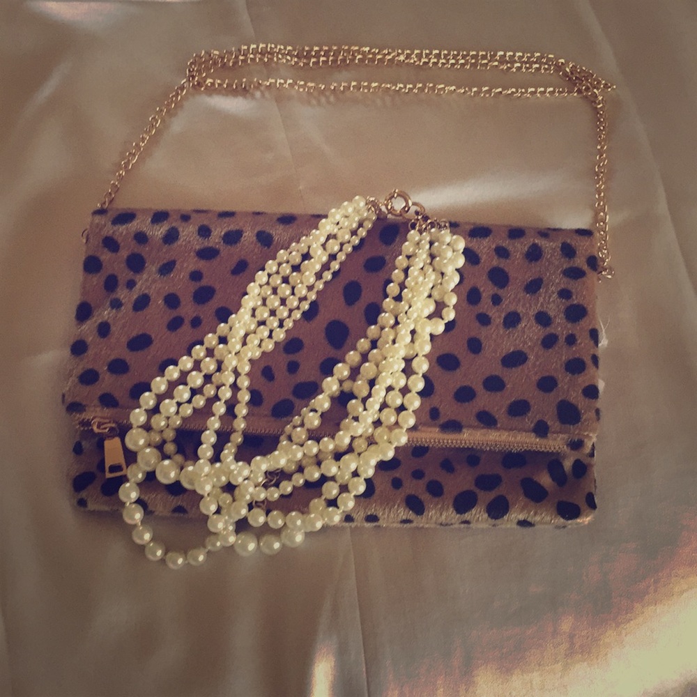 leopard fold over clutch.